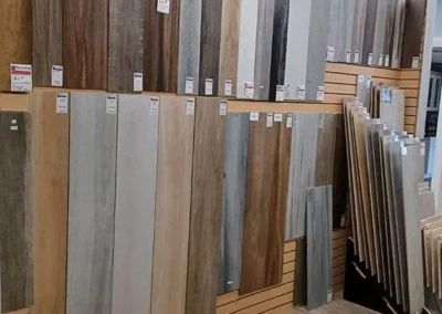 Interior of a flooring showroom with a variety of laminate and hardwood samples displayed